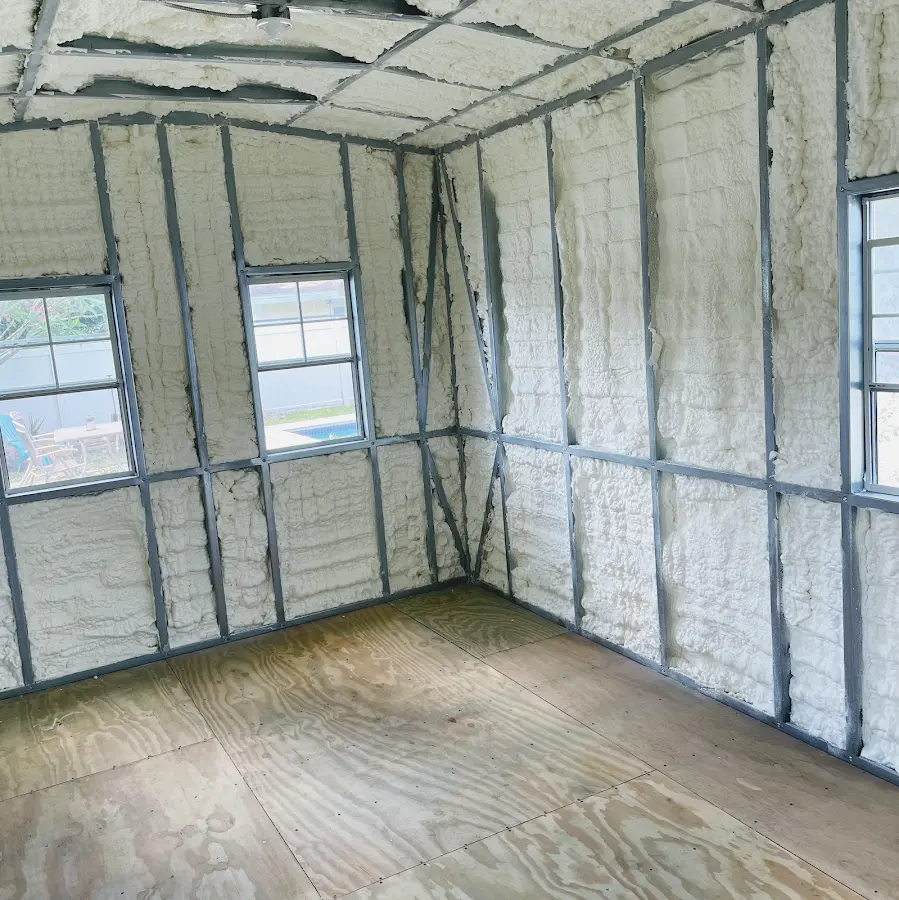Closed-cell spray foam insulation applied to wall cavities in a residential project in Rendon